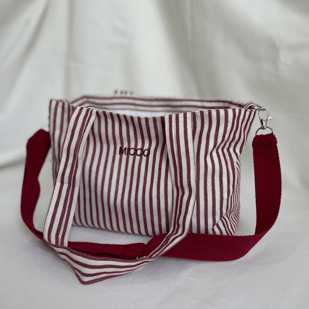 Bolso de tela forrado y con asas para ajustar desmontables